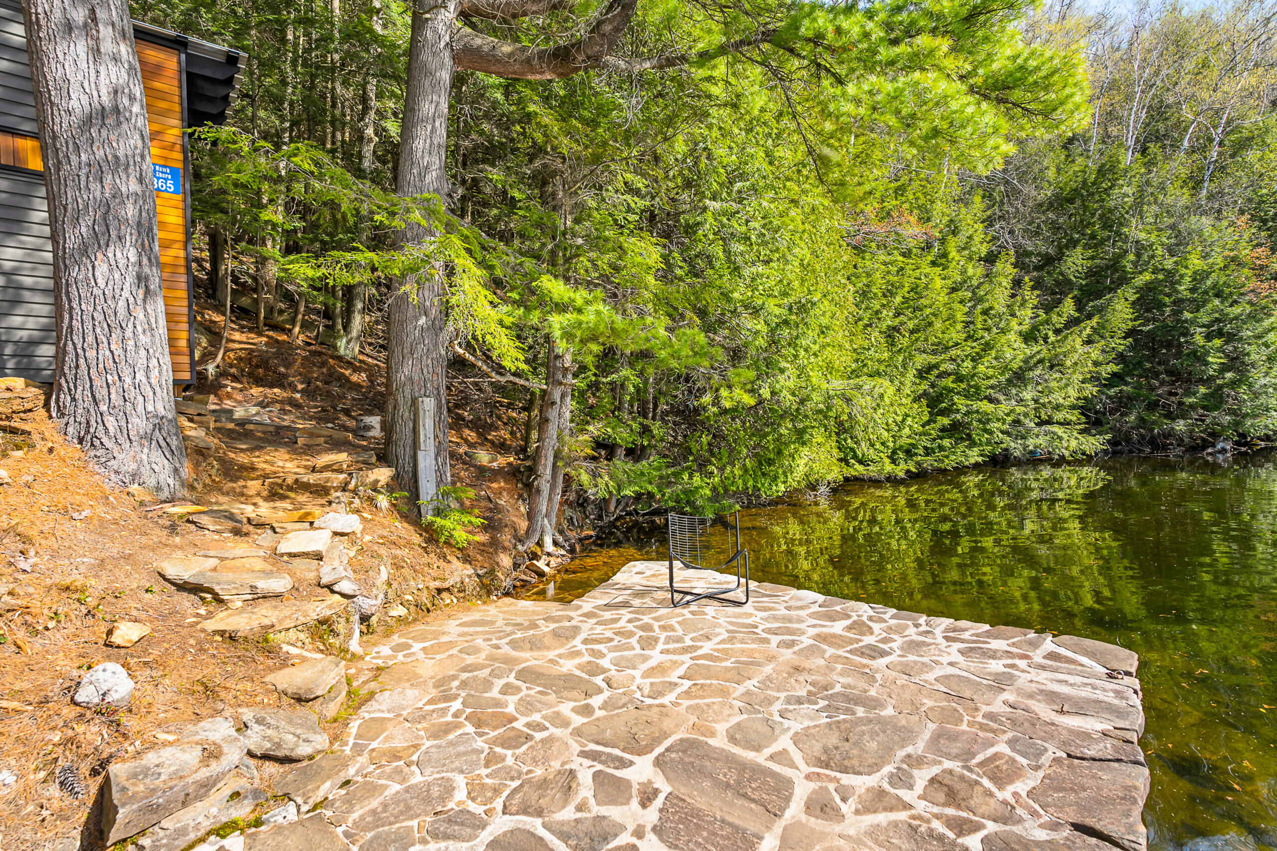 A stone patio near the water