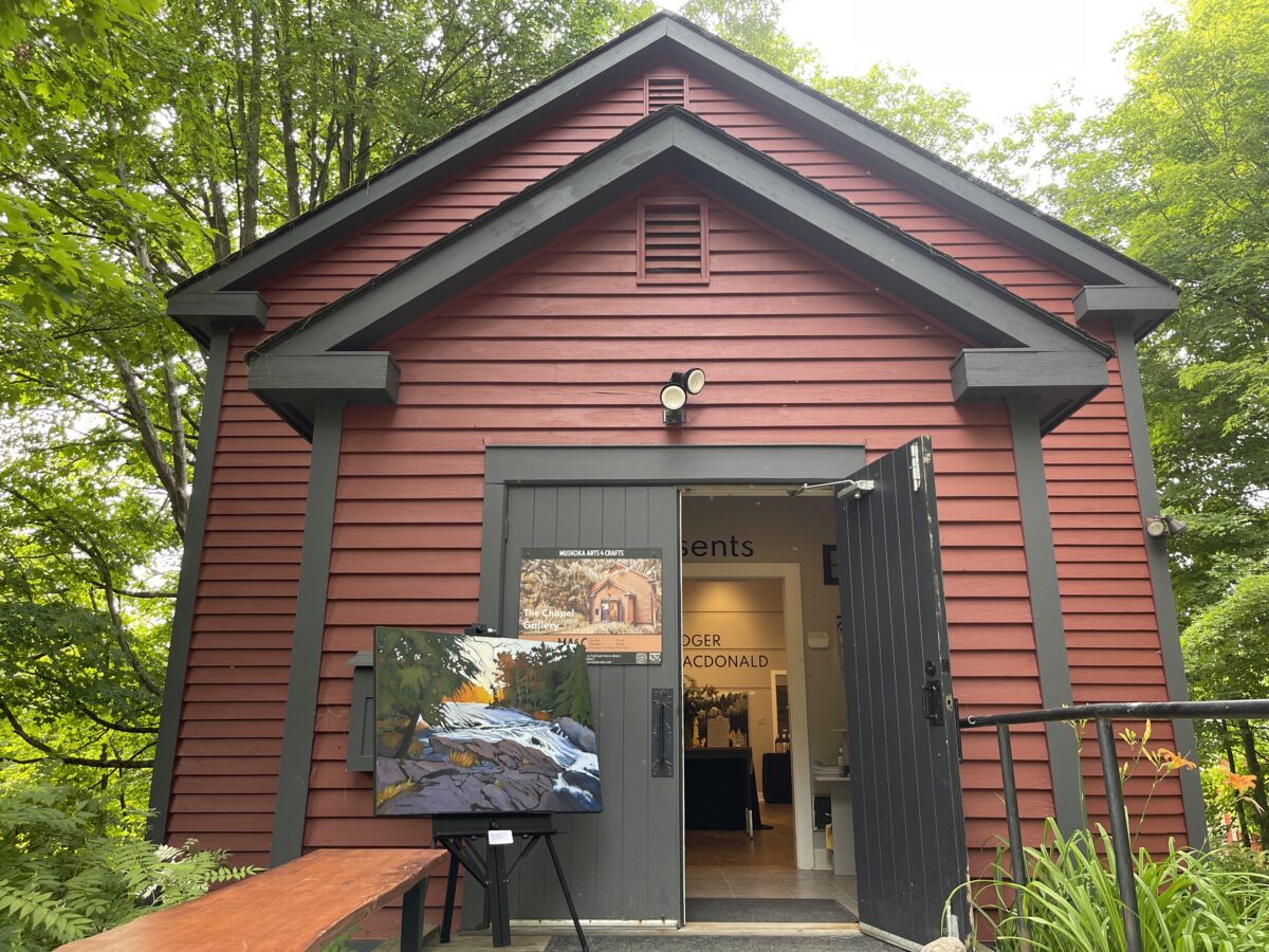 Red building with a painting outside