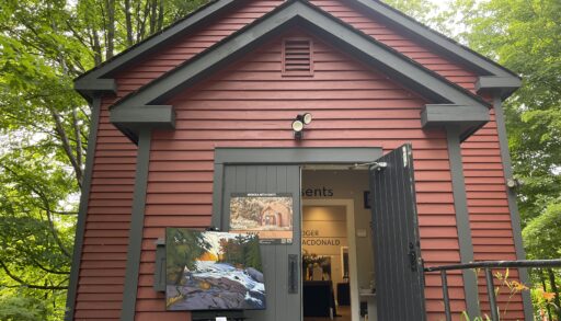 Red building with a painting outside