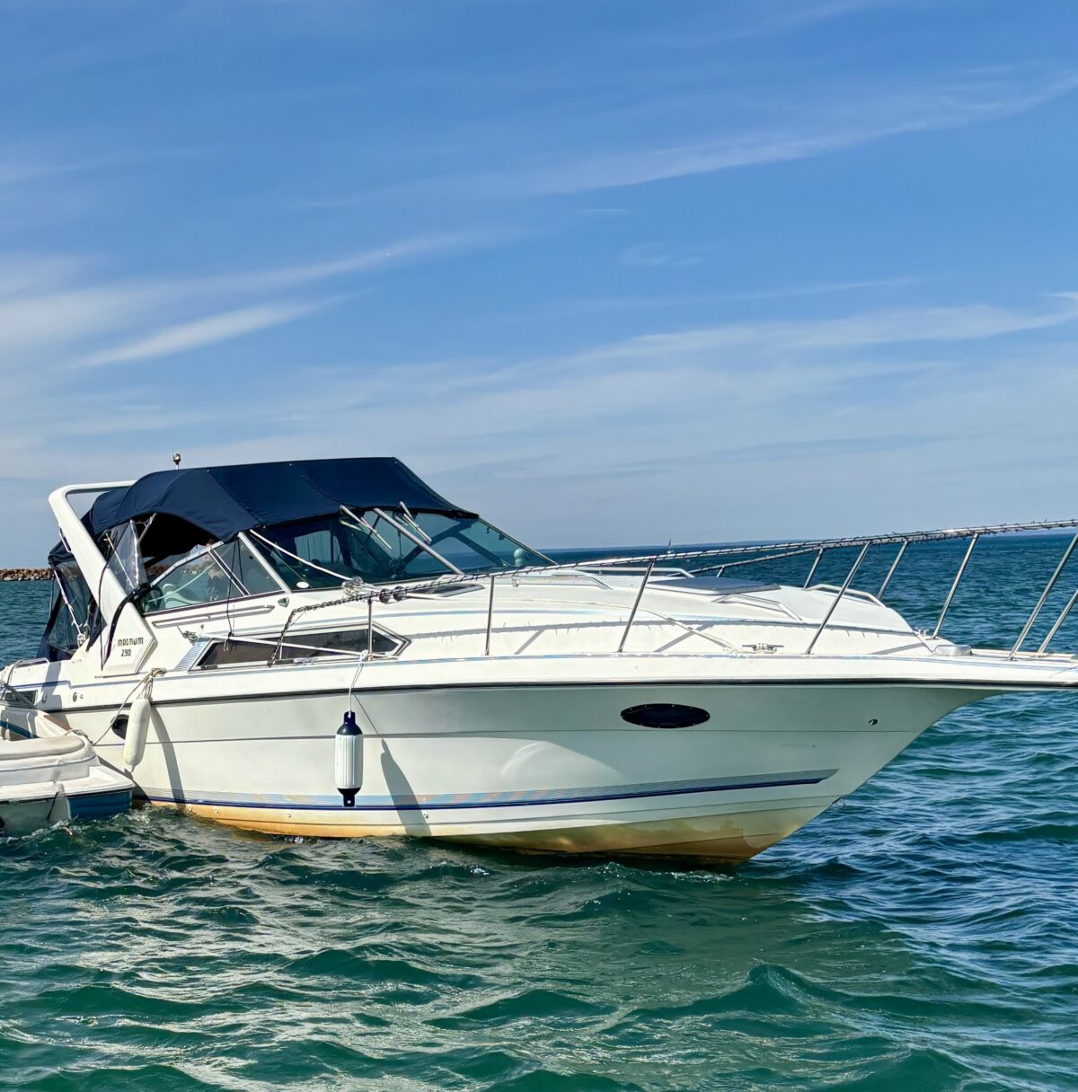 A white boat in the water