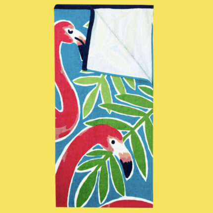 Beach towel with pink flamingos and tropical plants