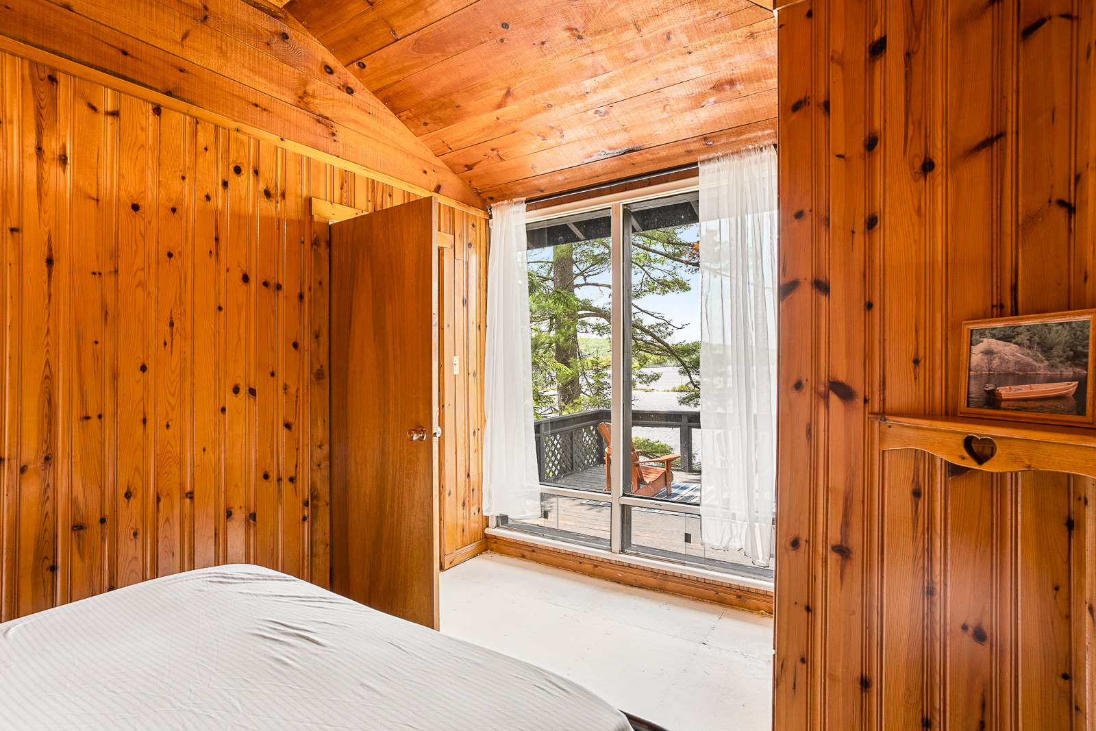 The bed looks out to sliding doors