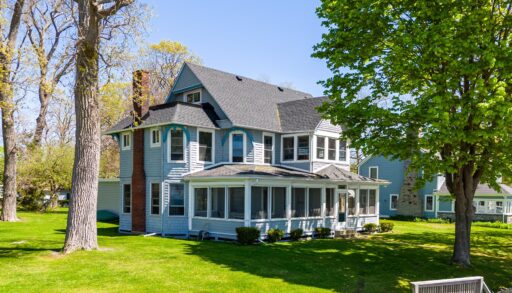 an exterior shot of a blue cottage