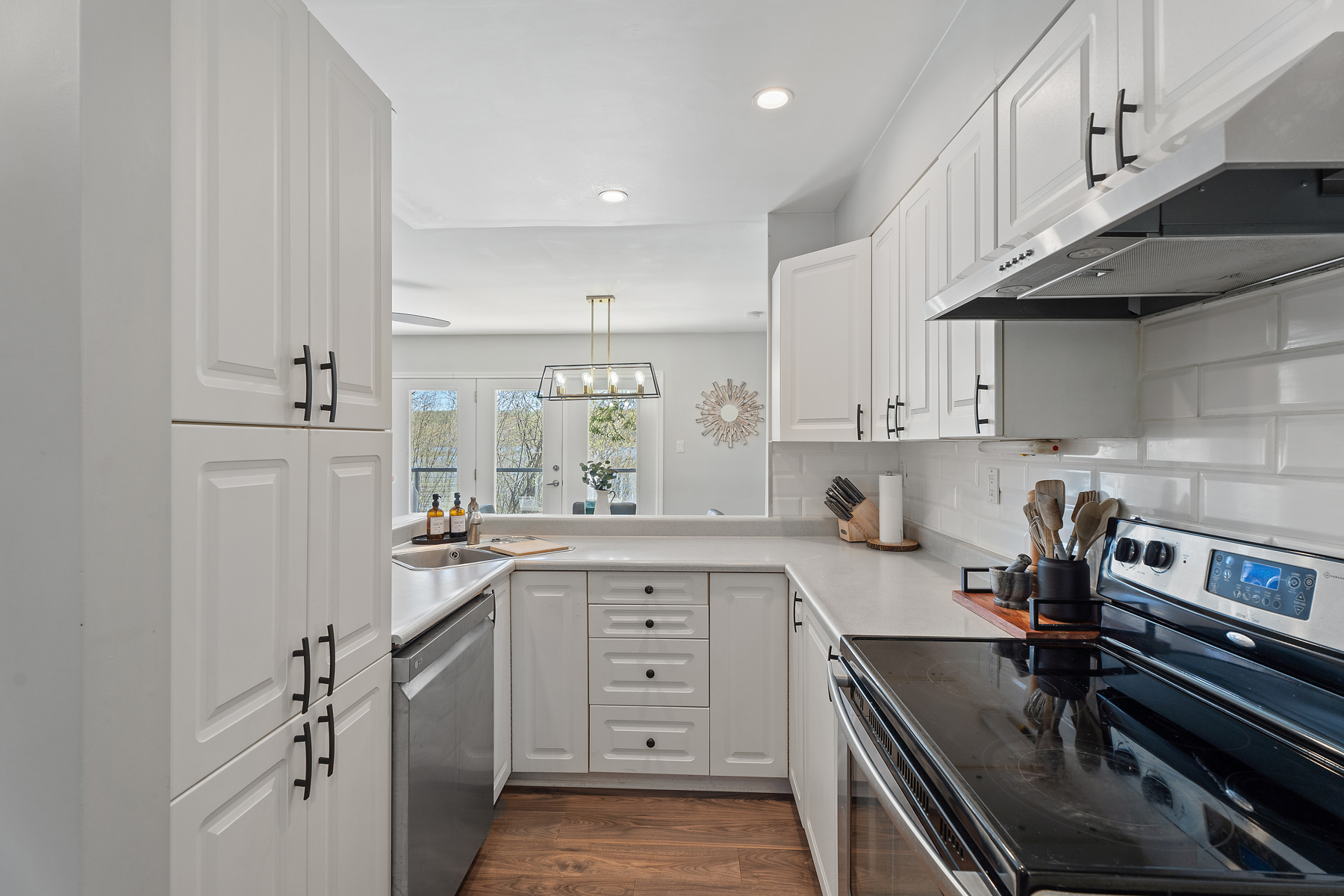 Reverse view of the kitchen looks out into the dining area