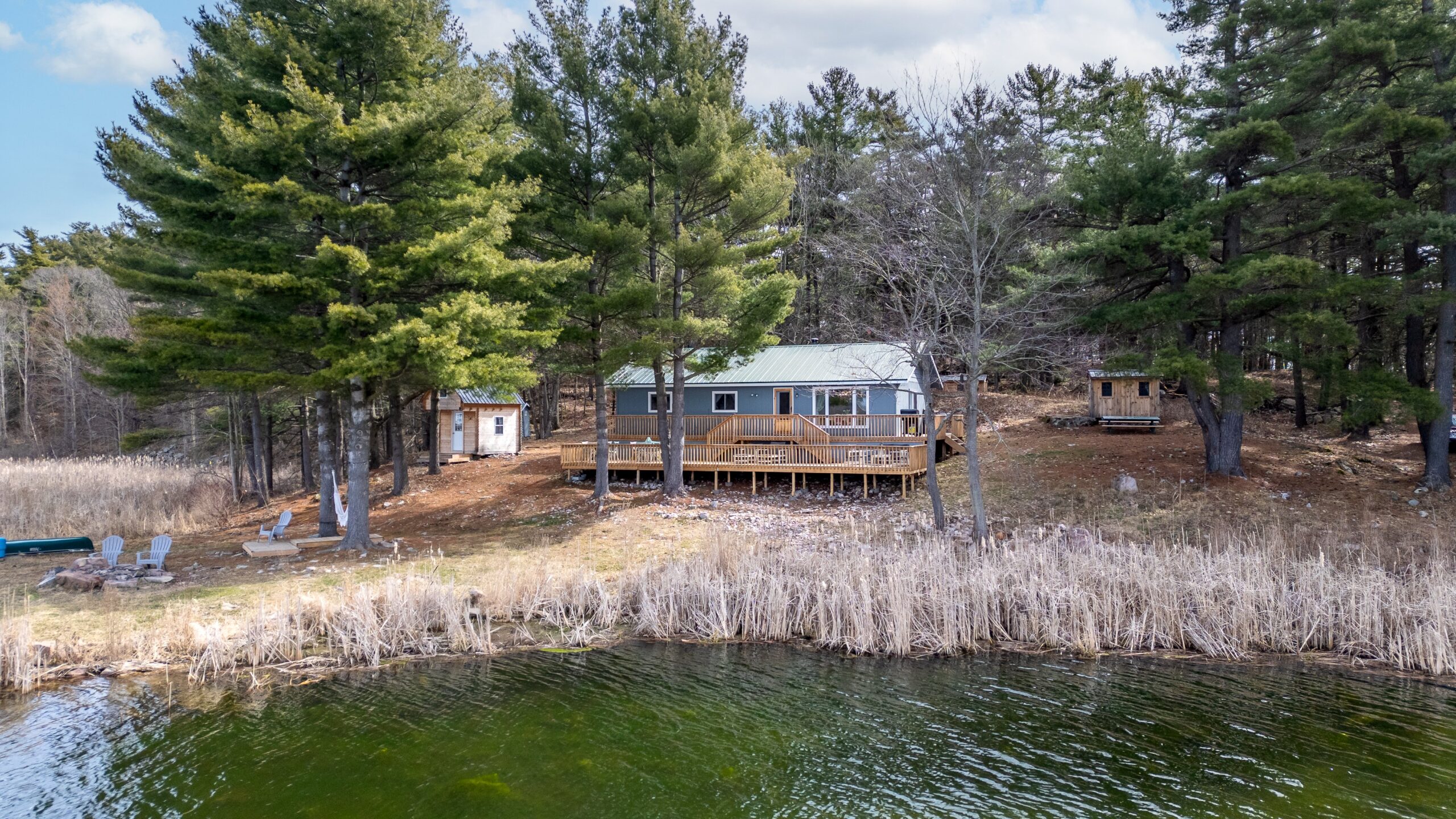A small grey cottage on the shore