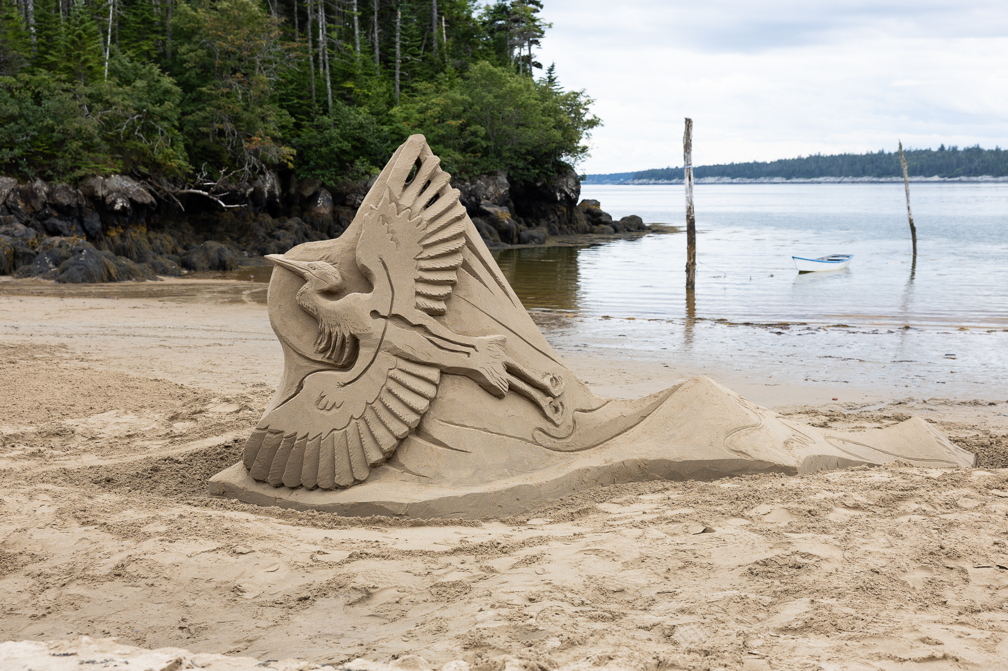 A sand sculpture of a great blue heron
