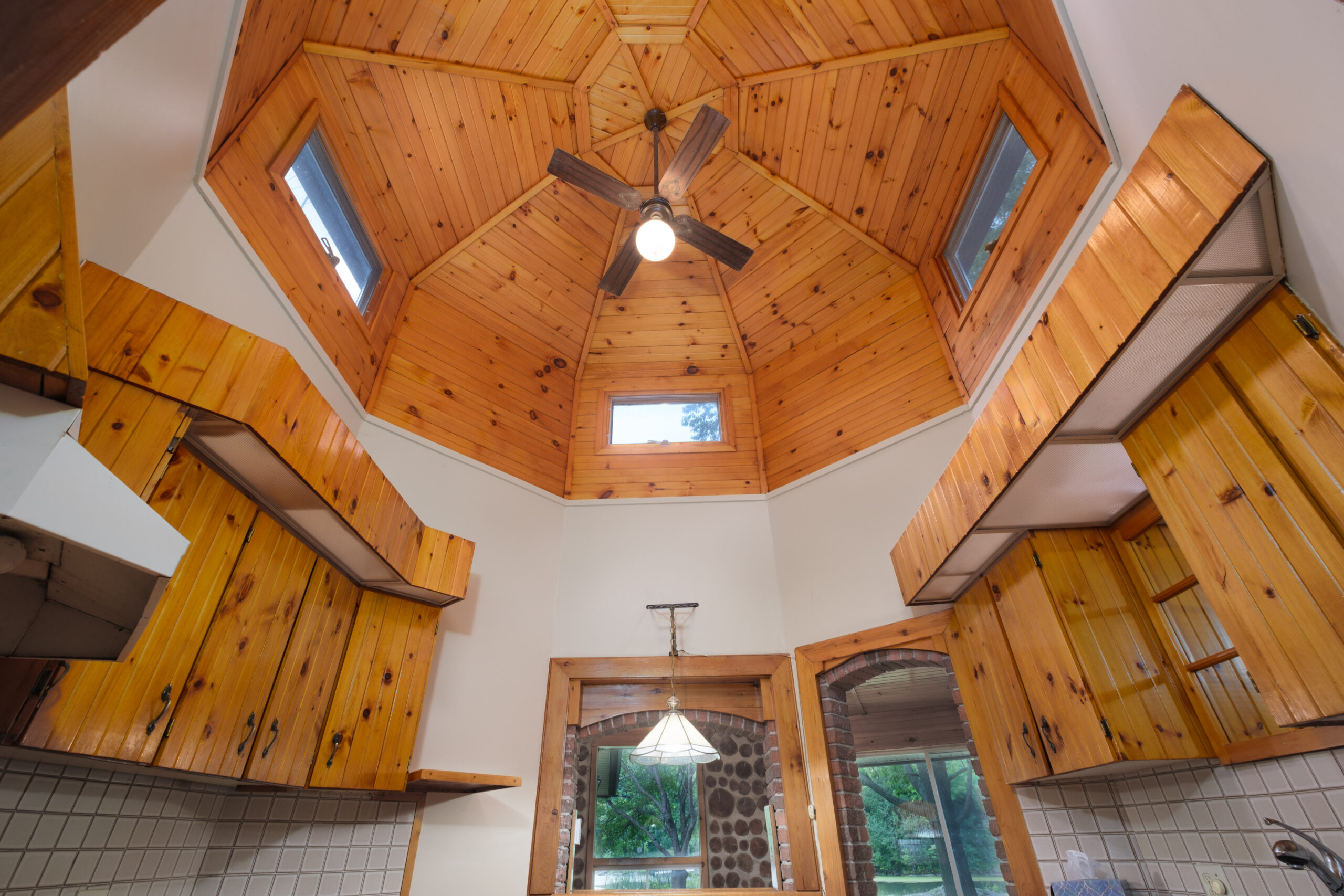 A huge wood vaulted ceiling with skylights