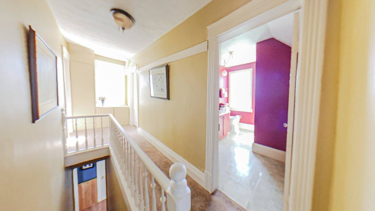 A cream painted upstairs landing