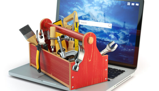 A toolbox sitting on an open laptop computer