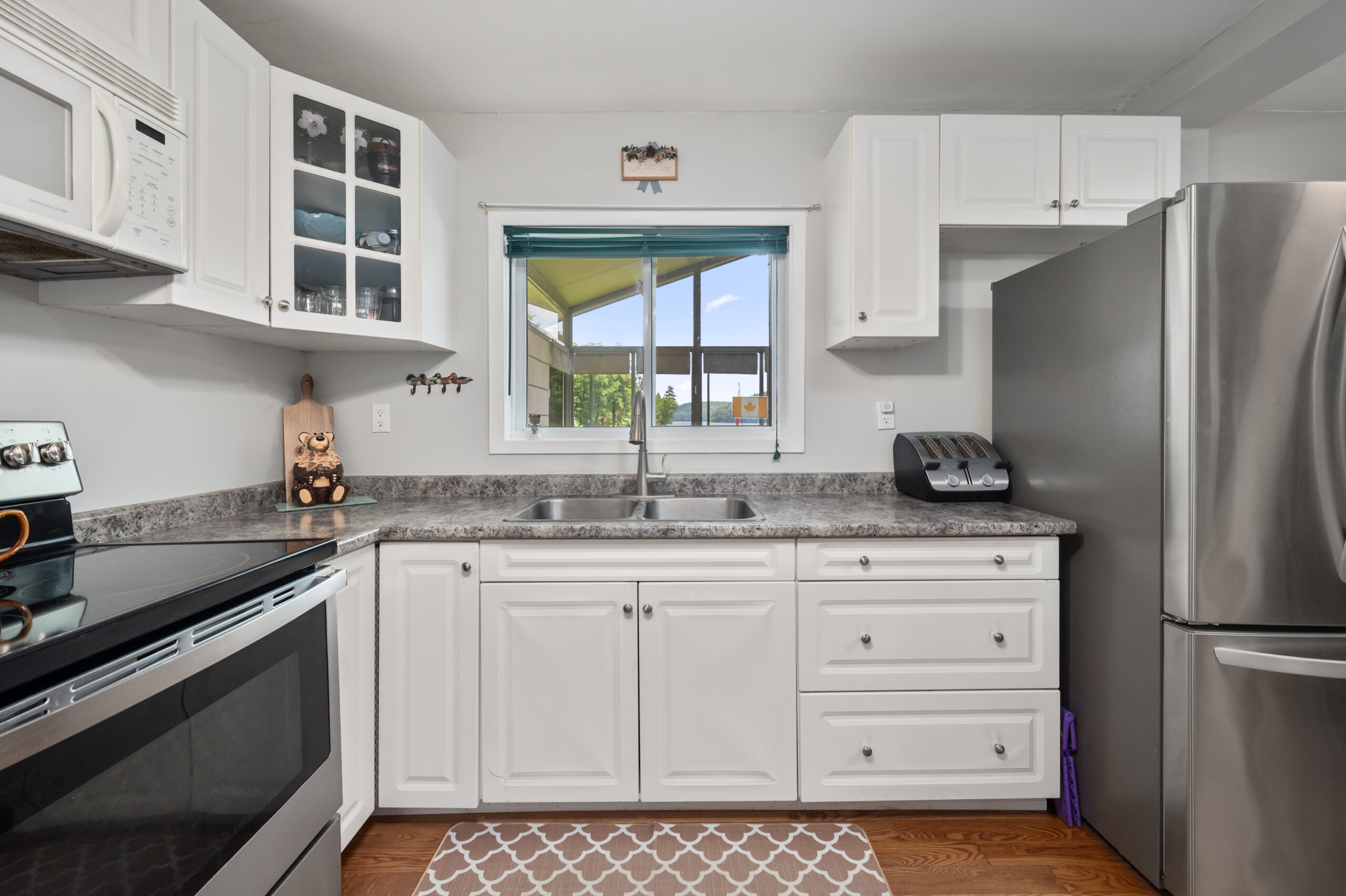 White cabinets line the kitchen