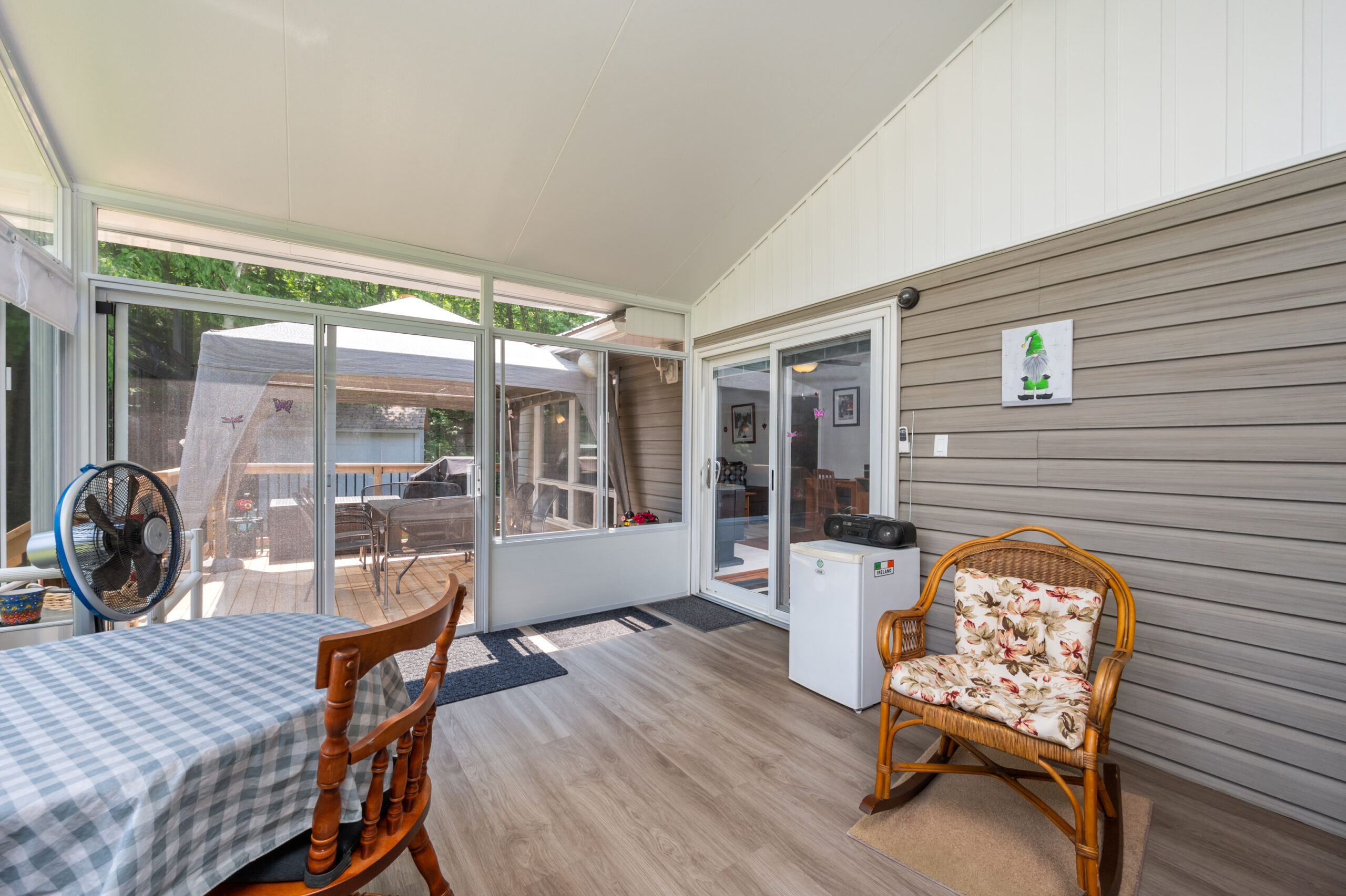 A wood chair faces a small dining table