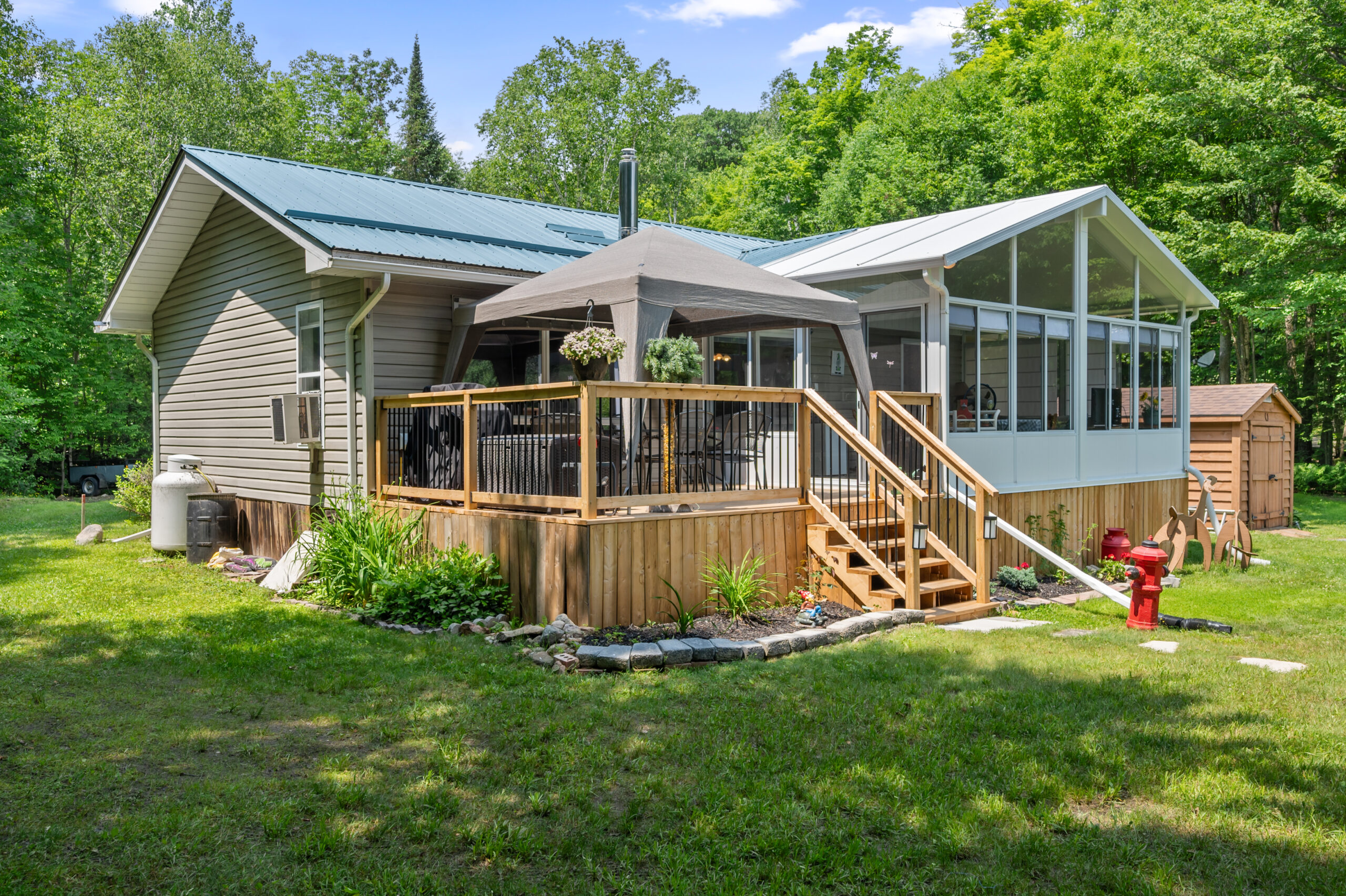 An enclosed gazebo on the back deck