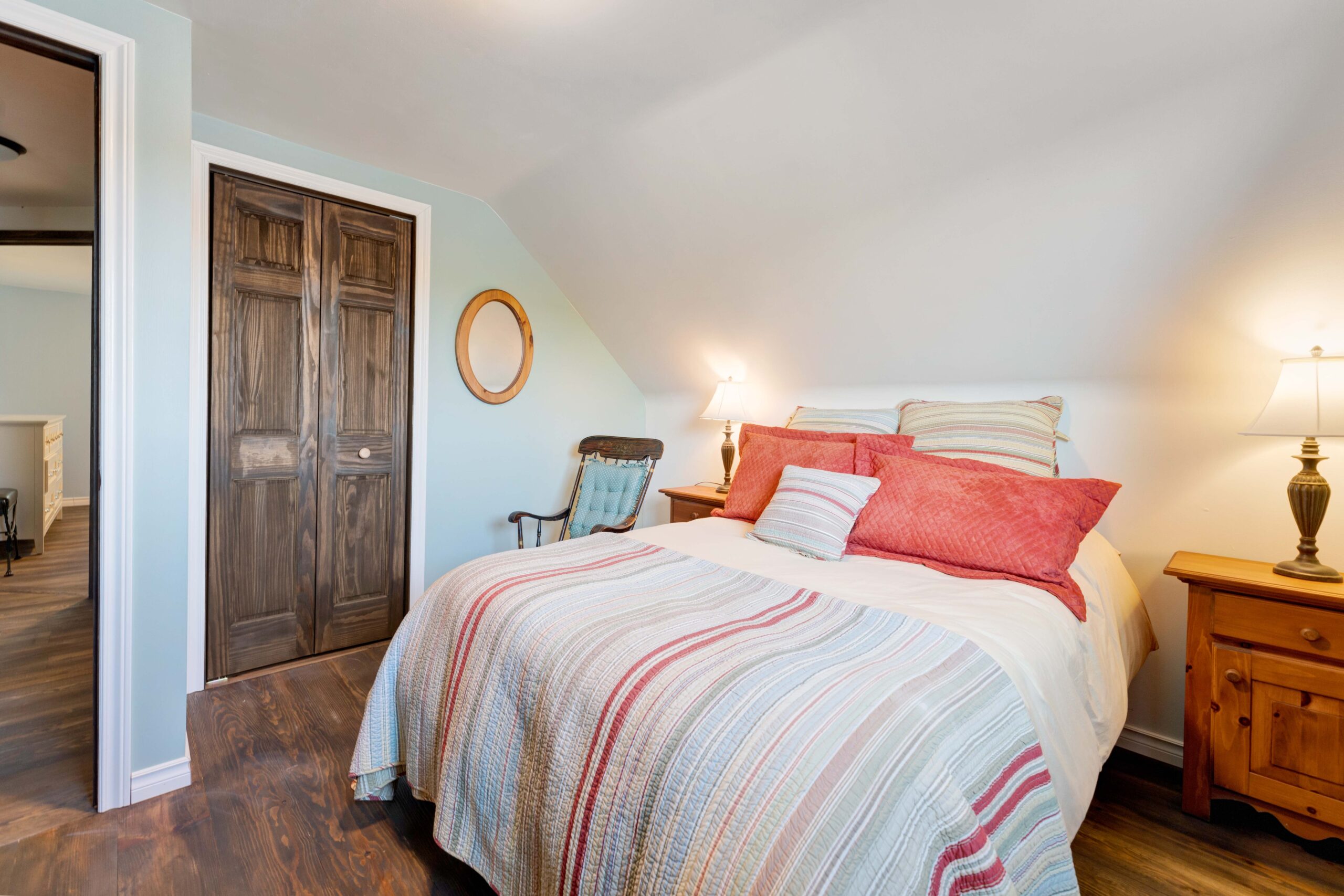 A red and blue striped bed in a blue room