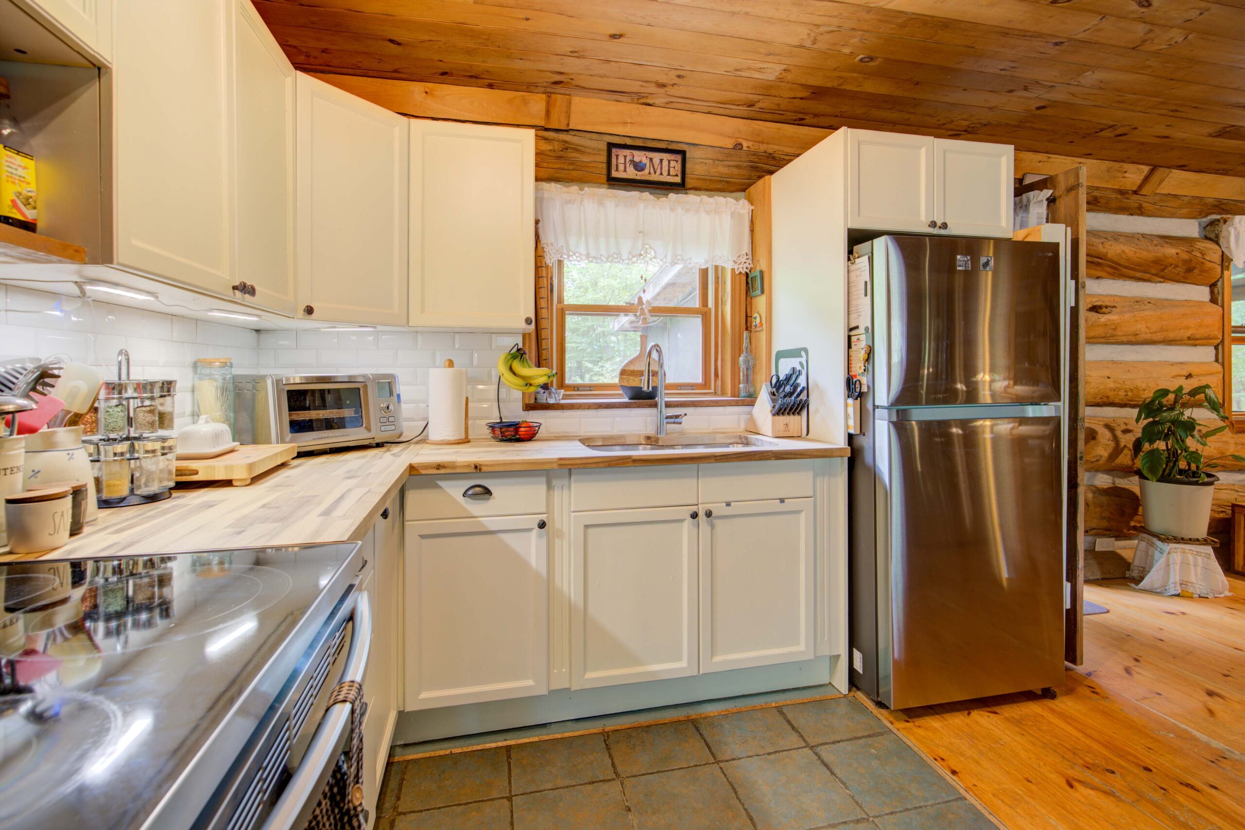 White cabinets in a kitchen with stainless steel appliances