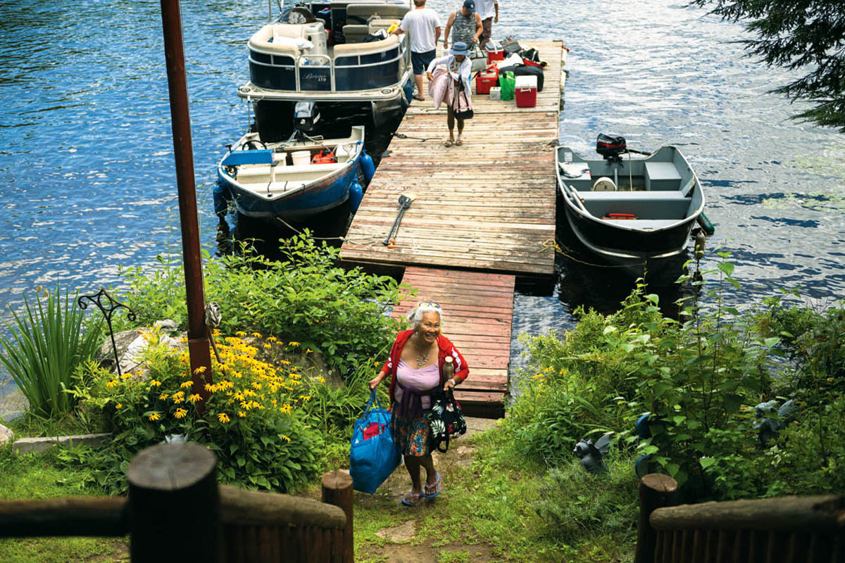 Auntie Rose brings up supplies from the dock where several boats are docked
