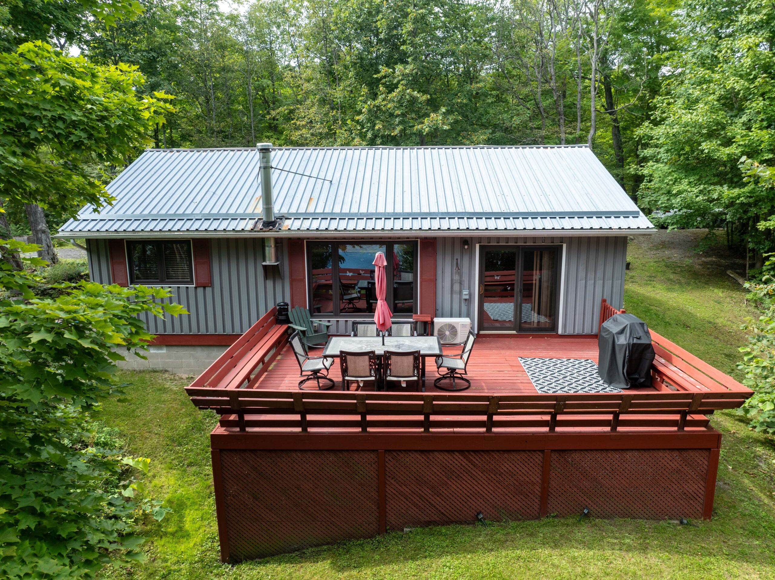 Aerial view of a large red deck with patio furniture