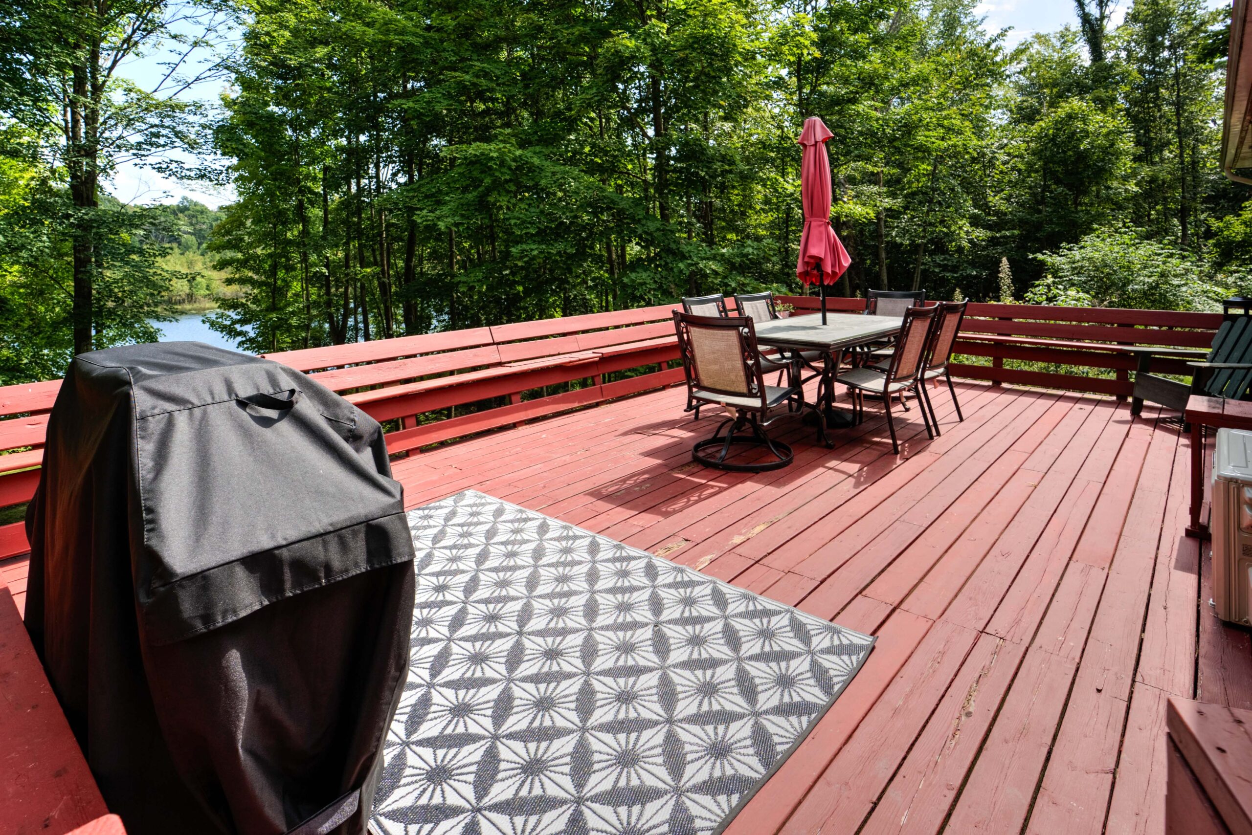 A red deck with a patio set