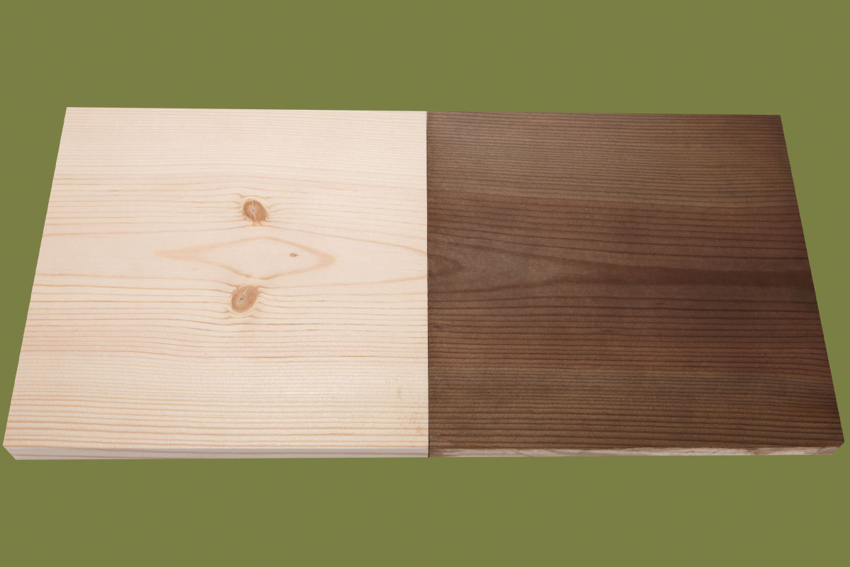 A board partially darkened with an iron wash.