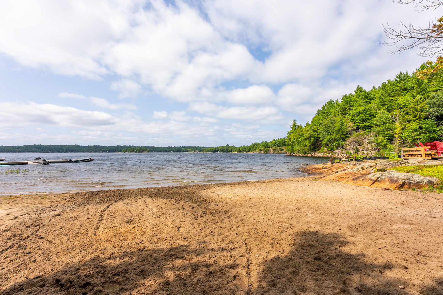 A large sandy beach beside the lake