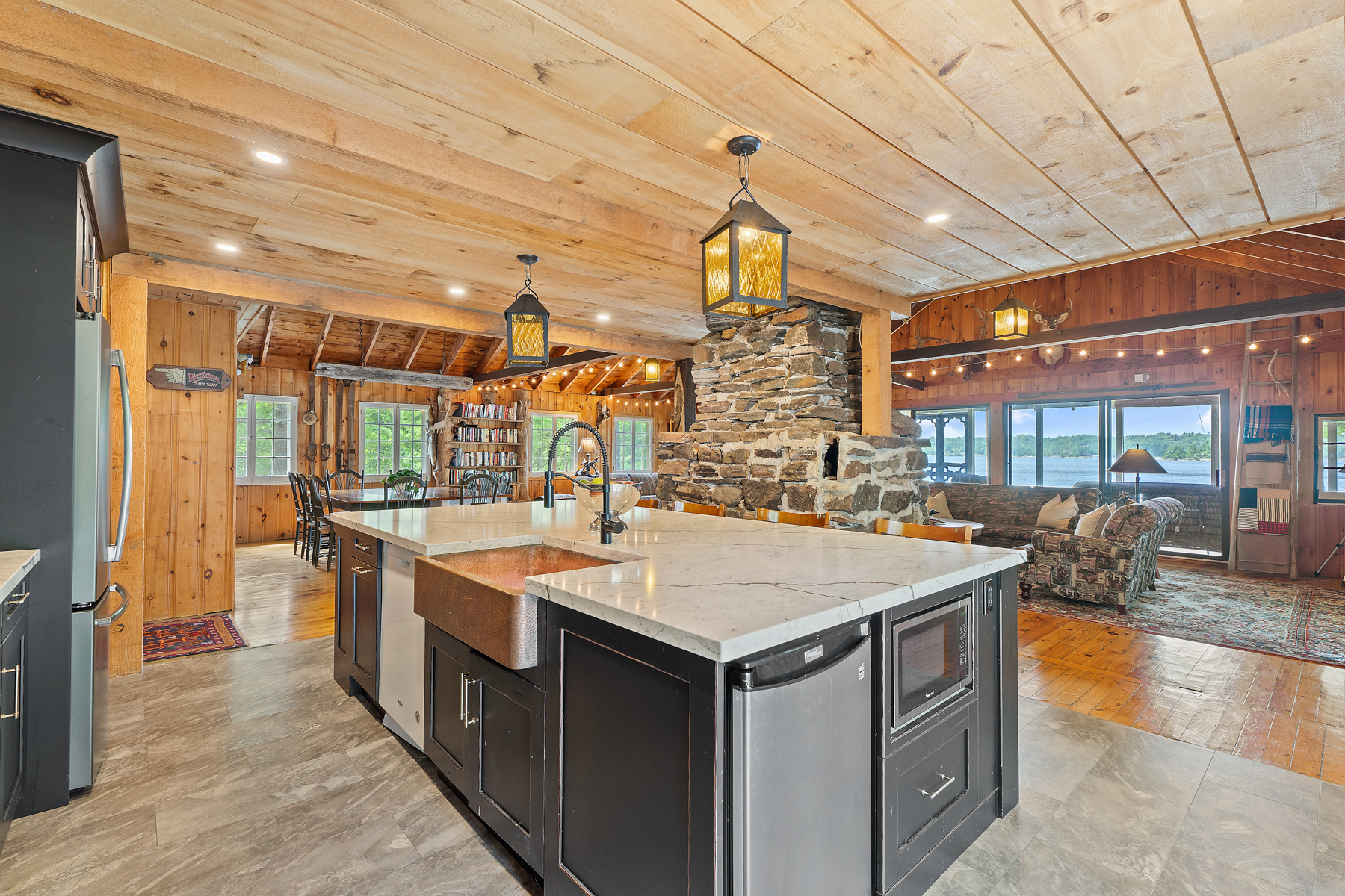 A kitchen with black cabinets and white countertops