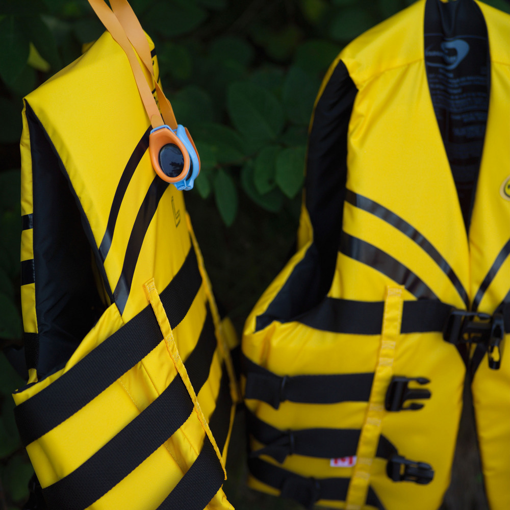 Two yellow lifejackets hanging up