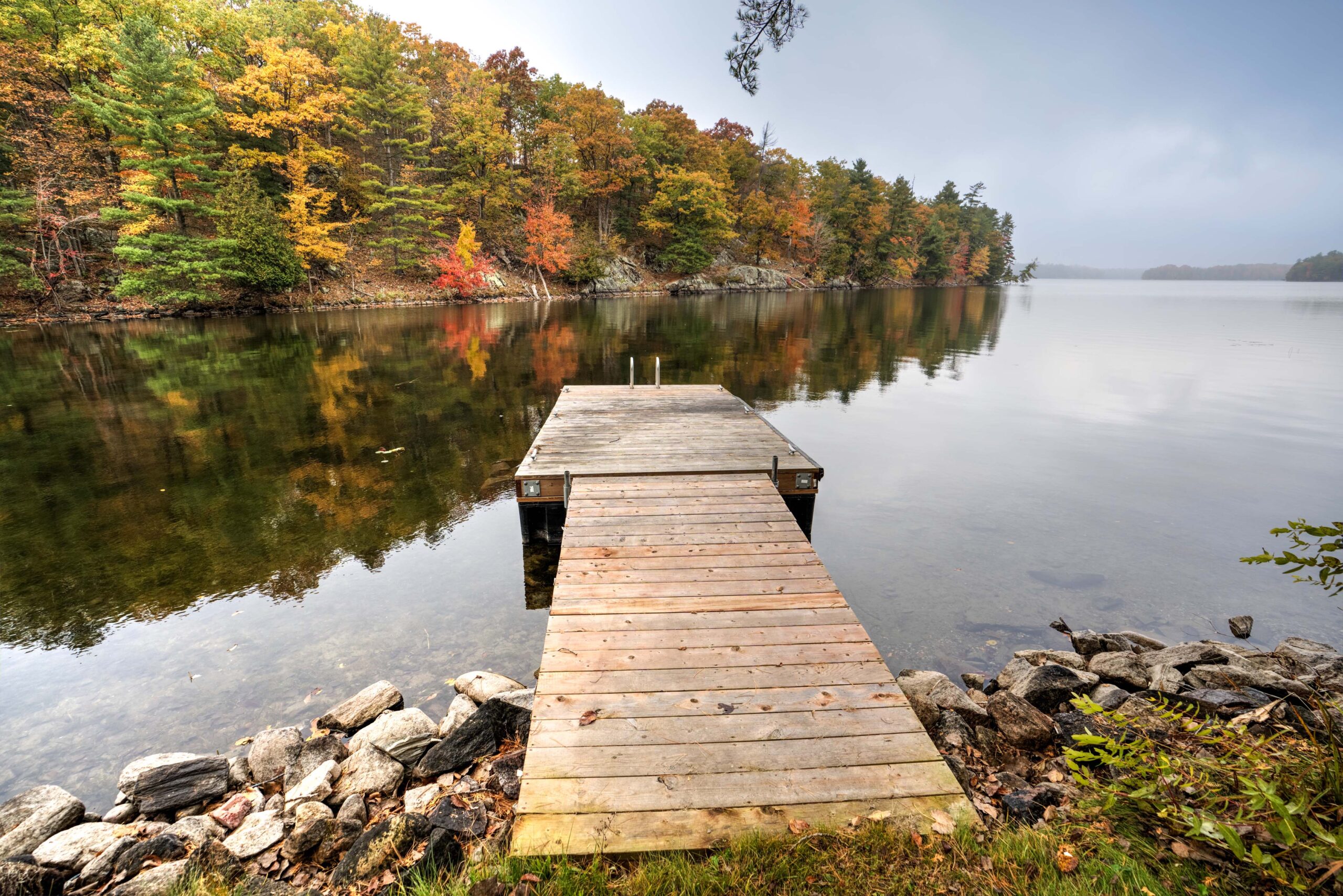 A dock juts out into the lake