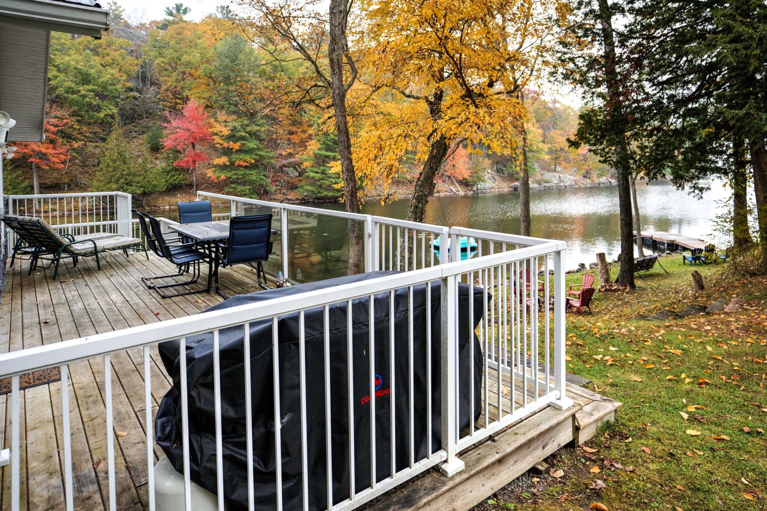 Patio furniture in the corner of a deck