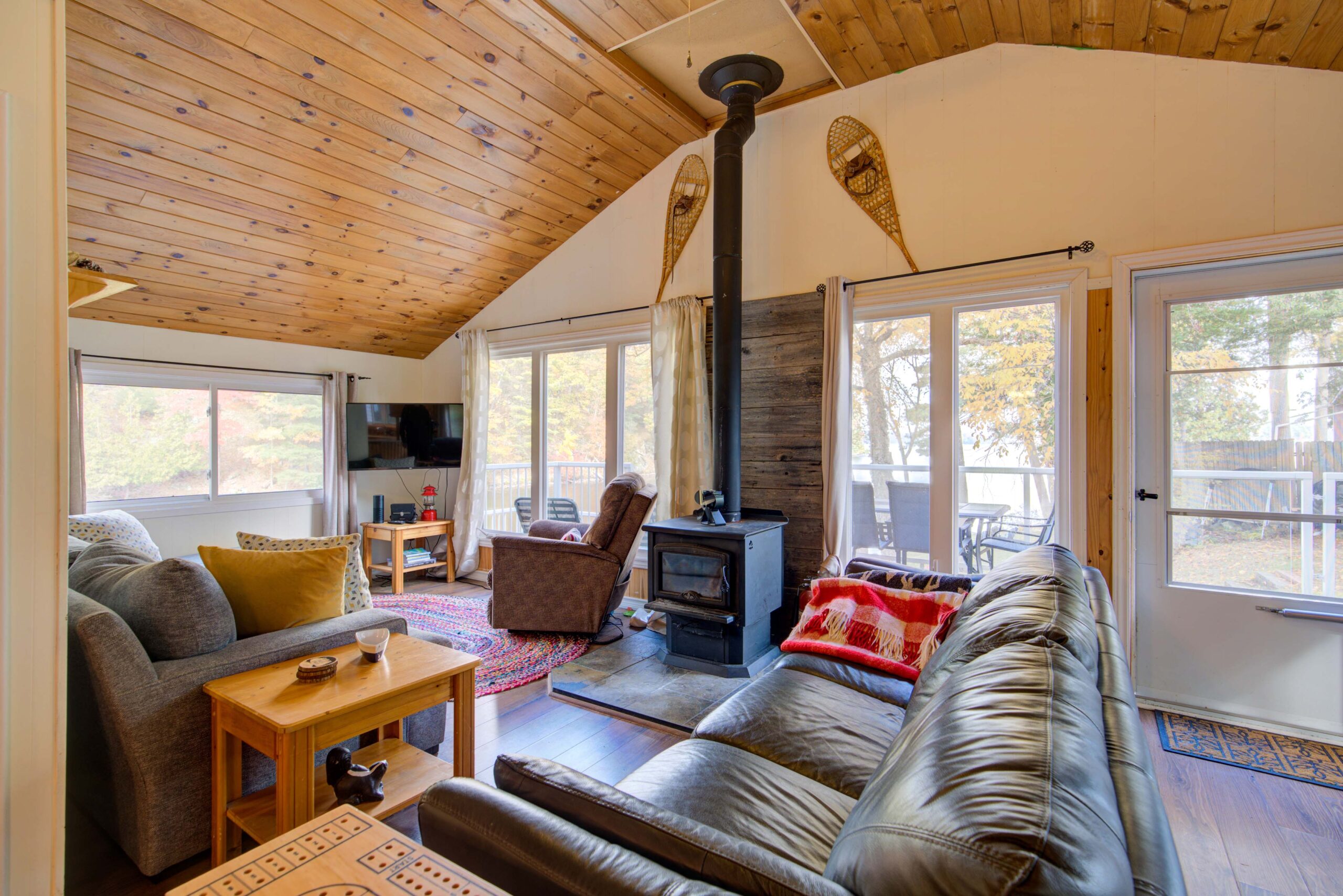 A grey leather couch faces the living room