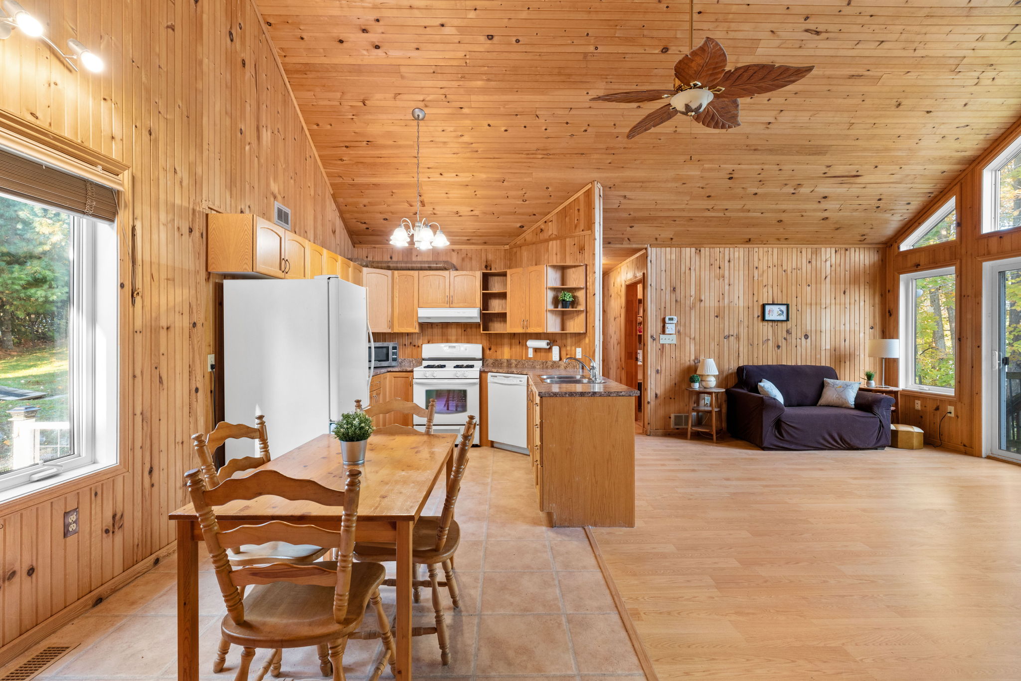 A wood panelled kitchen and dining area