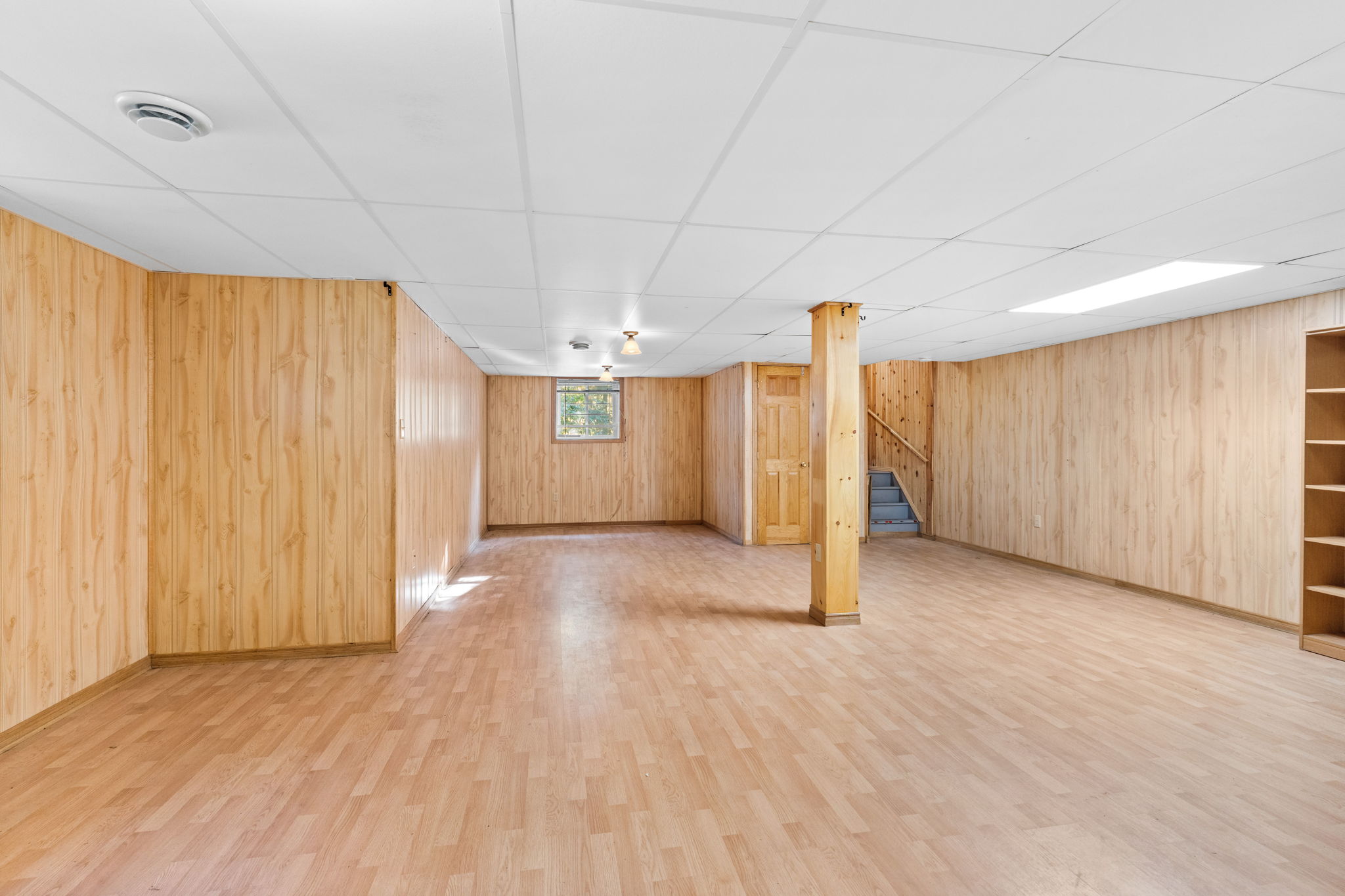 A finished basement with floor floors and walls