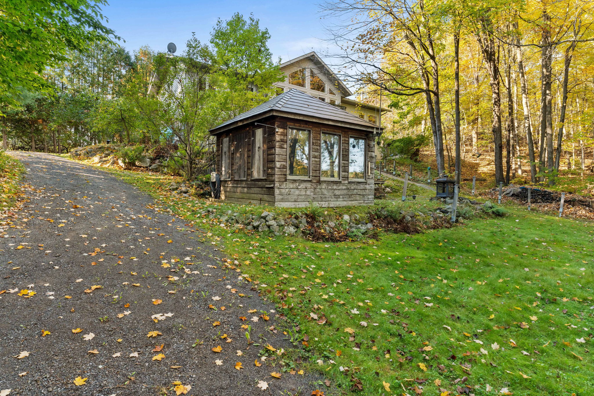 A wood-panelled shed with windows