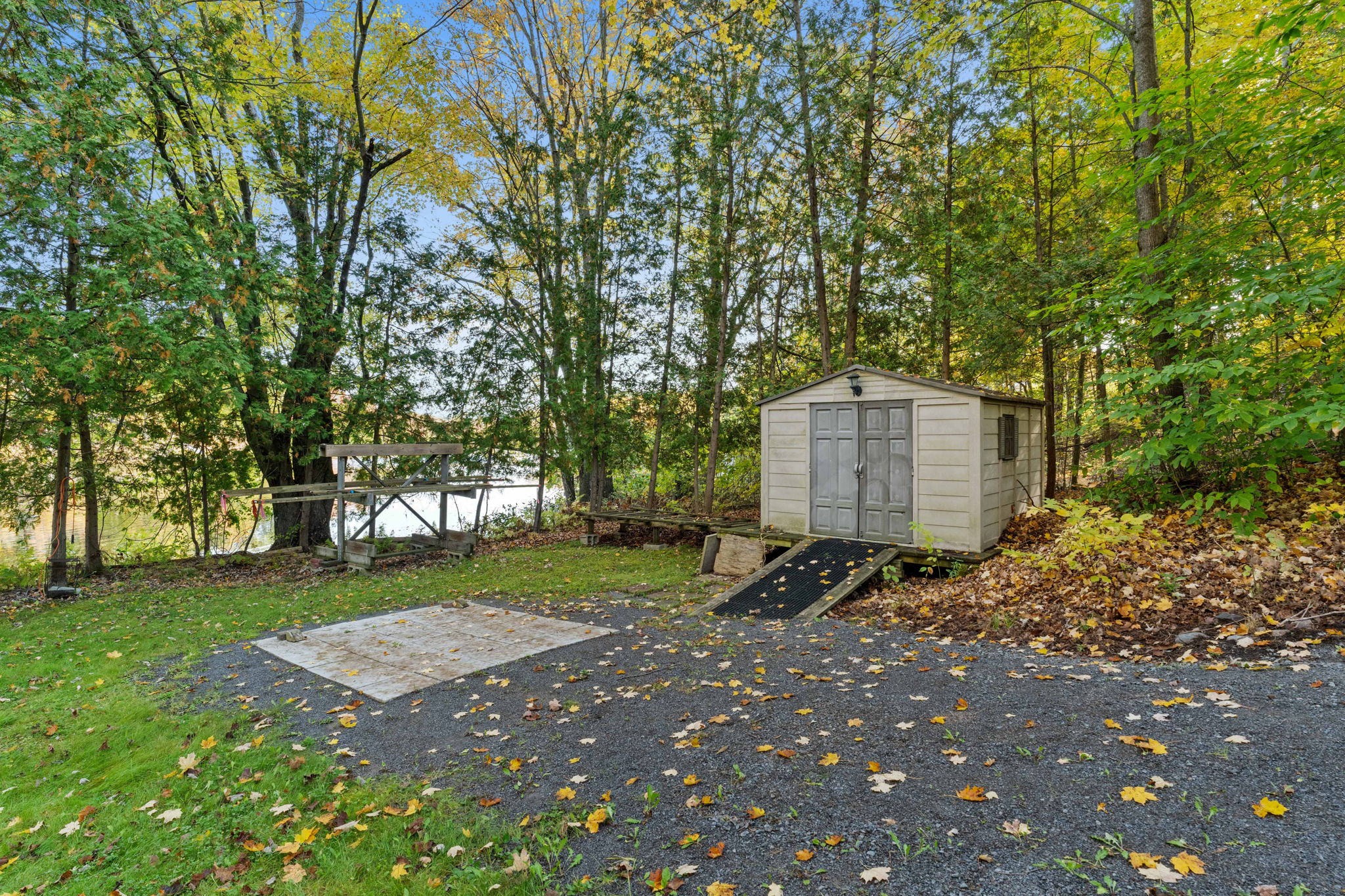 A small shed and driveway area