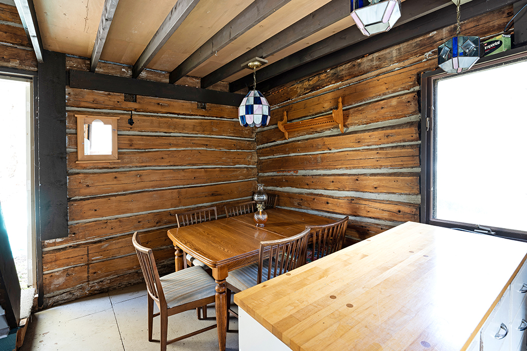 A small wood table in corner