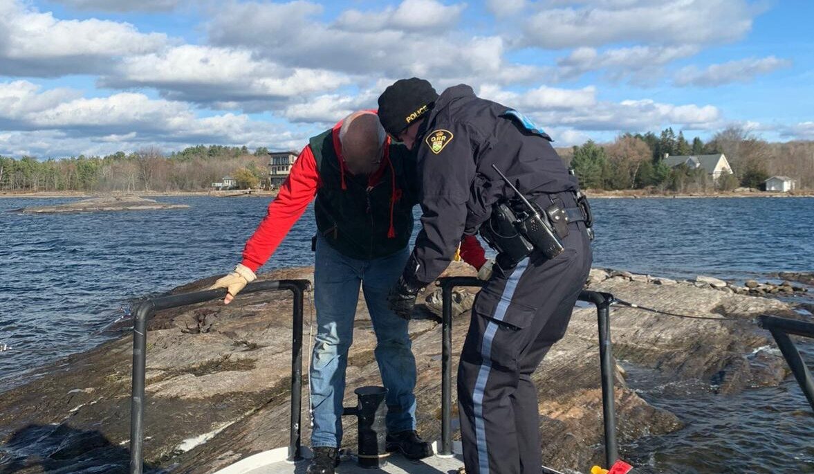 OPP rescue the man who was stuck on a shoal after going overboard into Georgian Bay. You can see his brightly coloured PFD in the corner of the photo