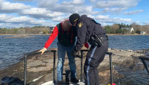 OPP rescue the man who was stuck on a shoal after going overboard into Georgian Bay. You can see his brightly coloured PFD in the corner of the photo