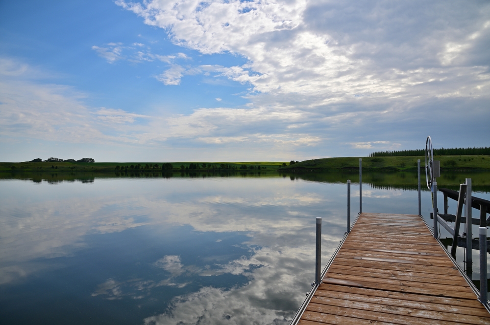 A wood and aluminum dock in the water