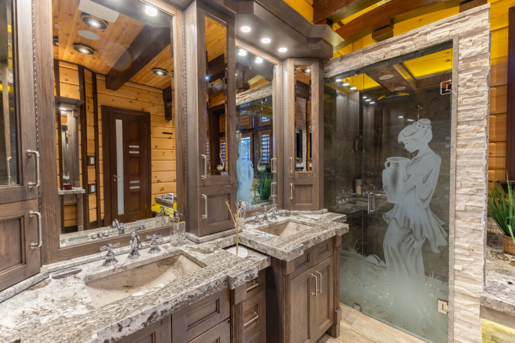 A bathroom with two sinks and a stand-up shower