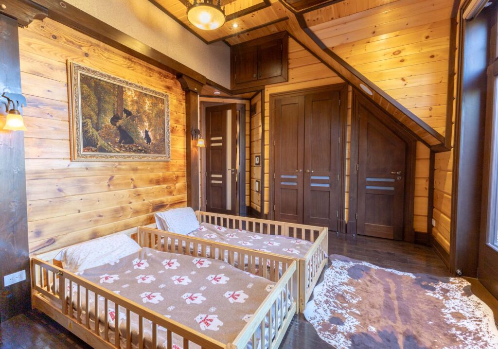Two wood beds on the floor with pink floral duvets