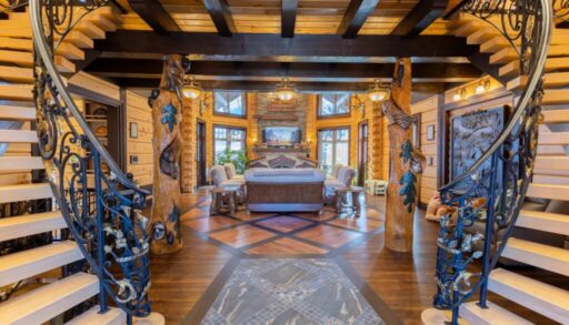 A long carpet leads into a huge living room with vaulted ceilings