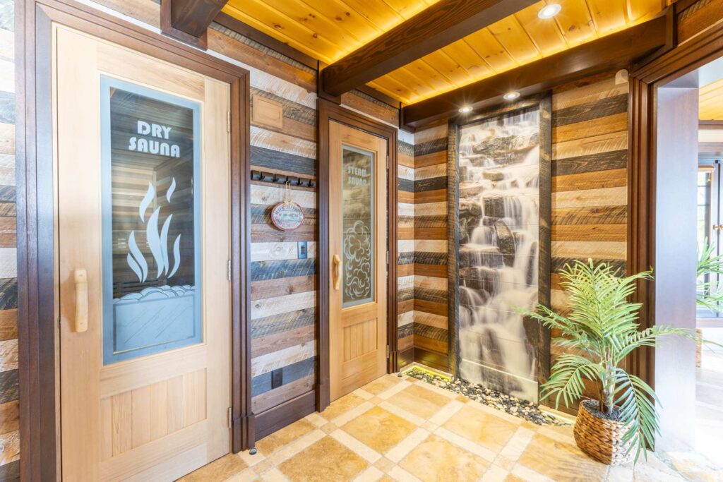 Two wood doors that advertise a dry sauna and steam sauna