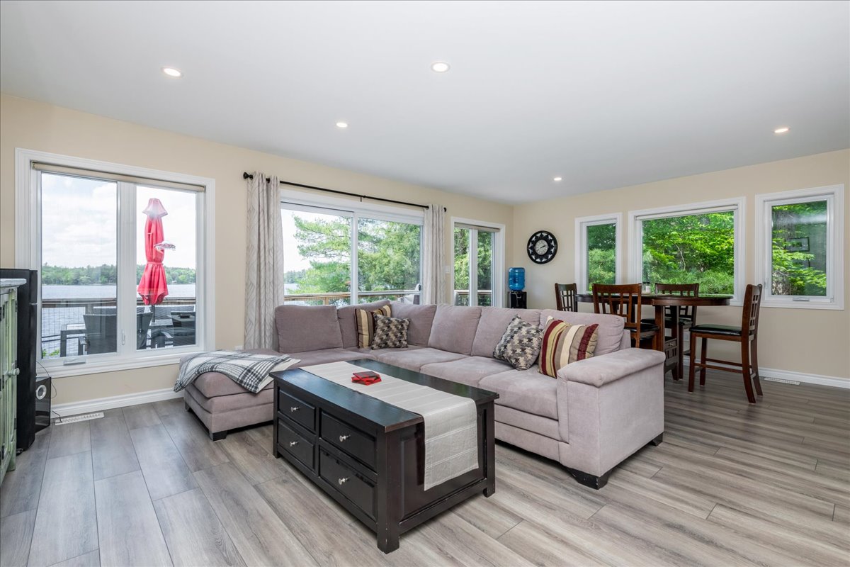 A grey L-shaped couch with a dark brown coffee table
