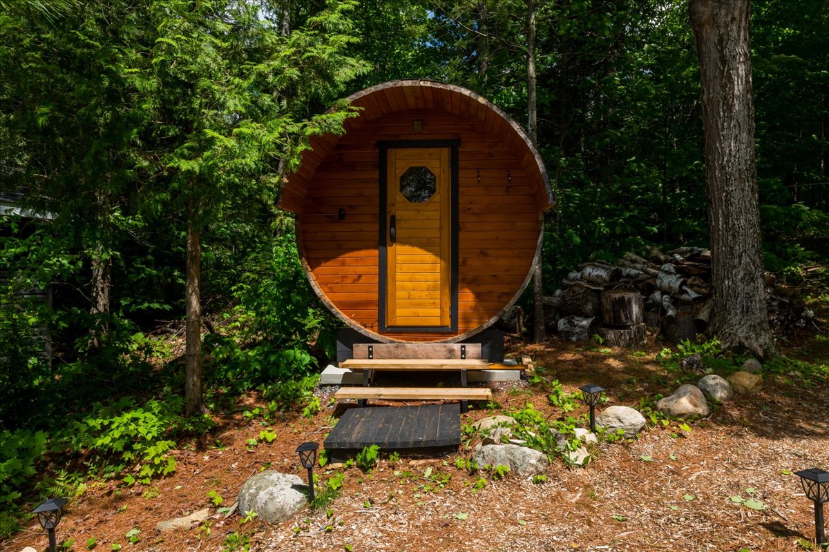 A round brown sauna in the forest