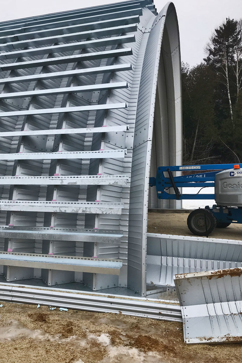 the external shell of a quonset structure showing what's called lateral ribs