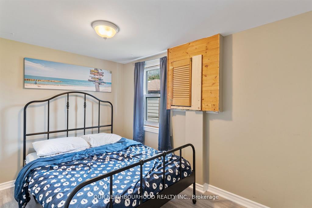 A blue and white bed on a black metal frame