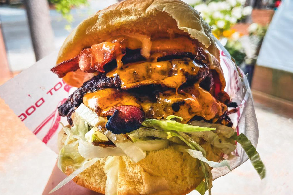 a photo of a stacked cheeseburger