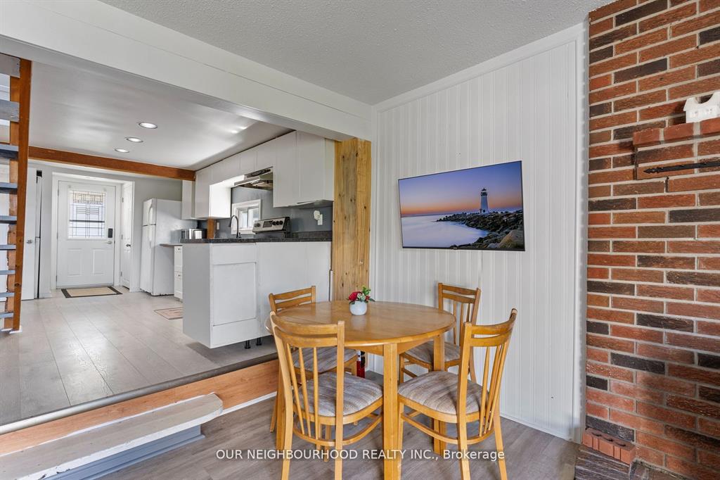 A small round table with wood chairs