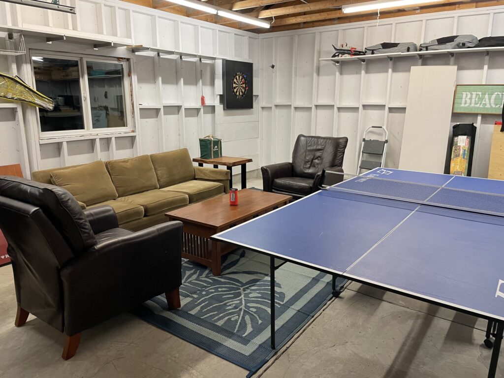 A blue ping-pong table in a garage
