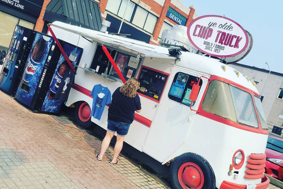 a photo of a white and red chip truck