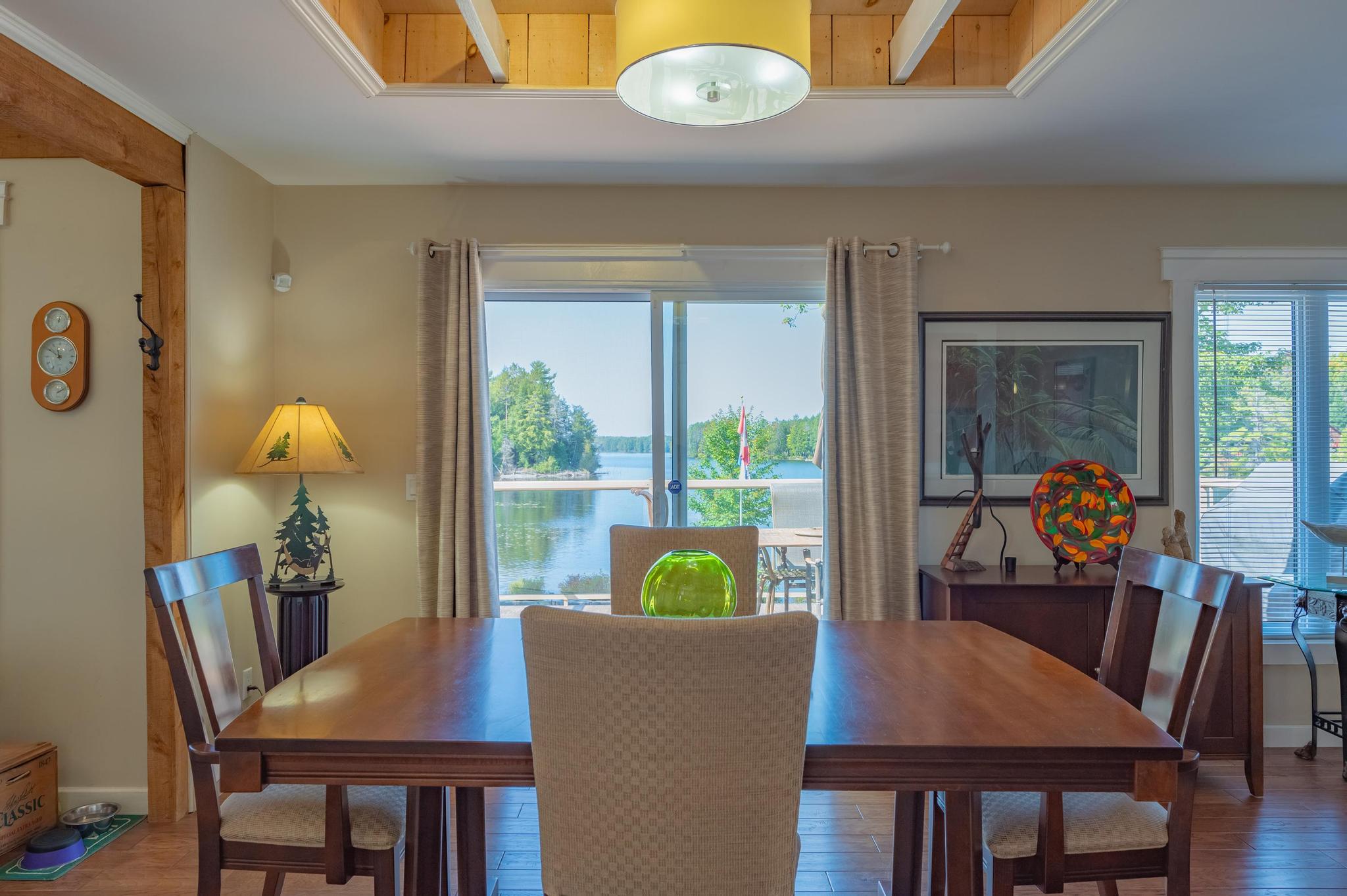 A spacious open-concept living and dining room with modern decor and plenty of natural light.