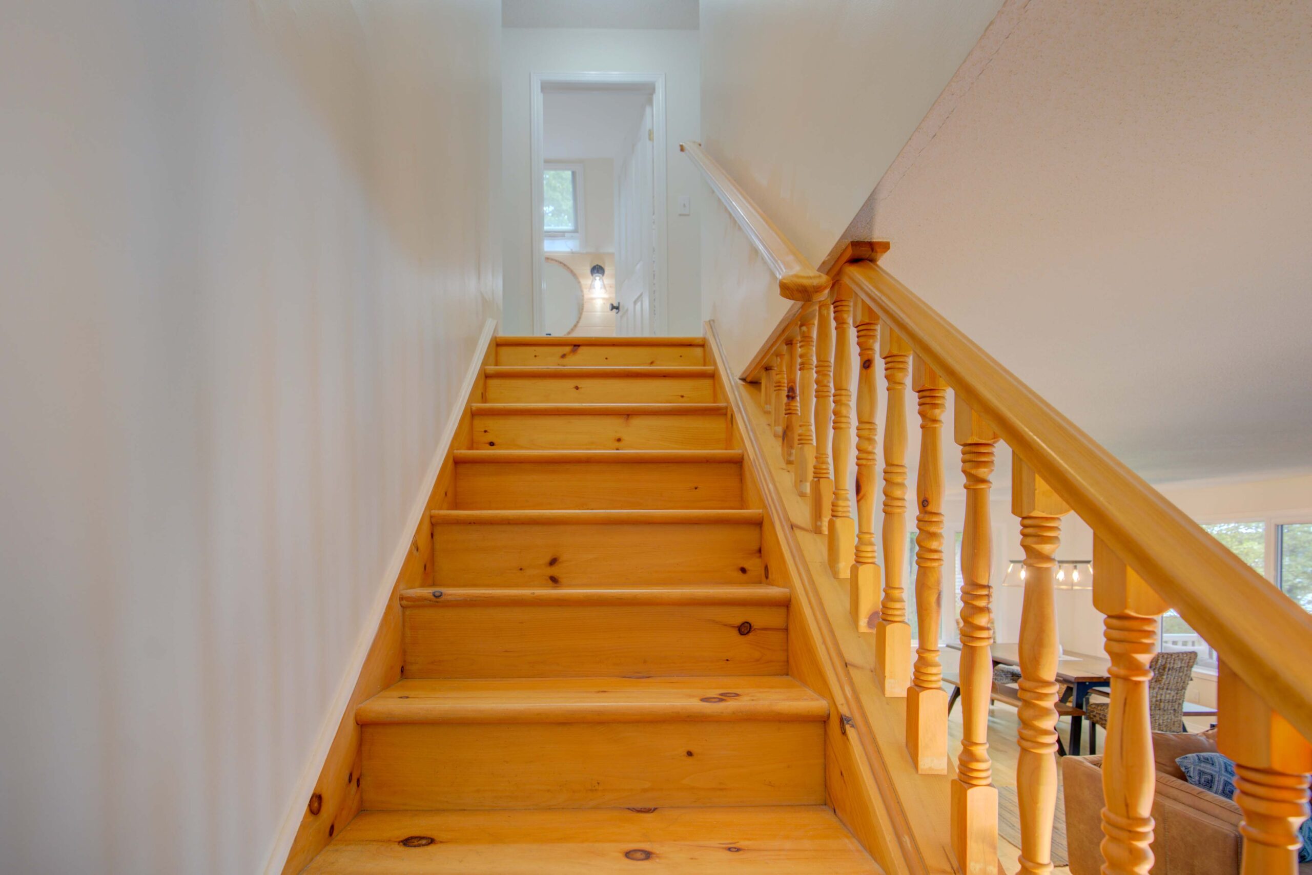 Wood stairs lead to the second floor